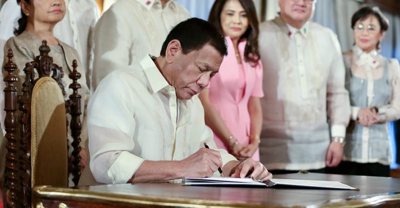 Duterte signs law giving Filipina moms 105 days paid leave