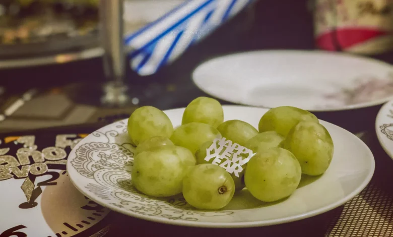 Why Are We Obsessed with Eating 12 Grapes Under the Table?